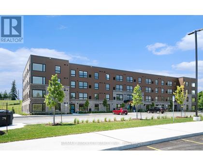 A large building with a parking lot in front of it.
