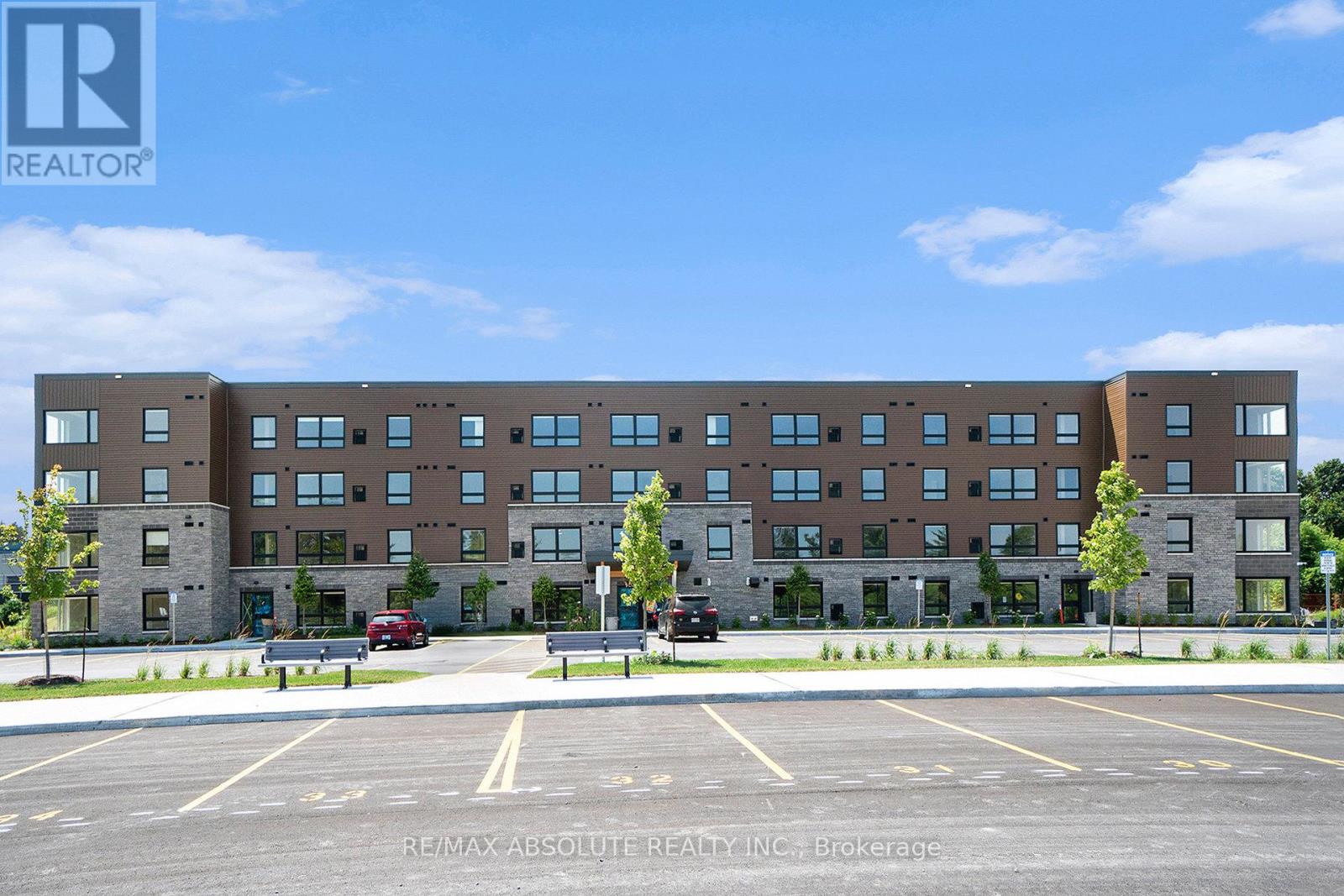 A large building with a parking lot in front of it.