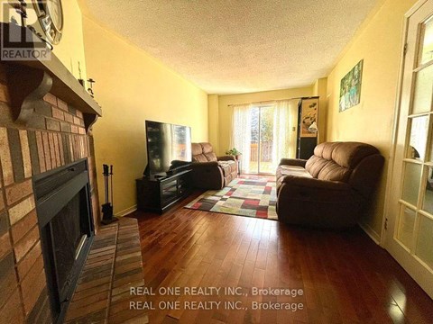 A living room with a fireplace and a couch.