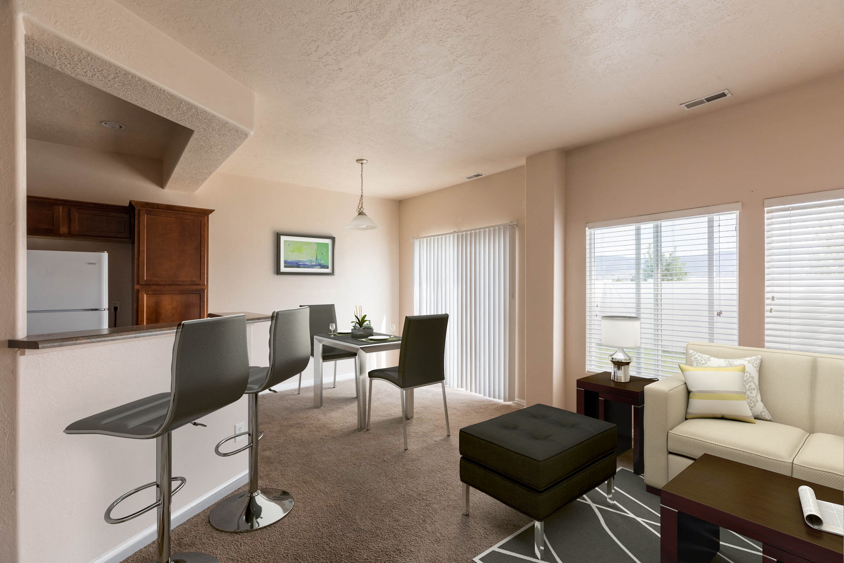 a living room and dining room with a couch and a table