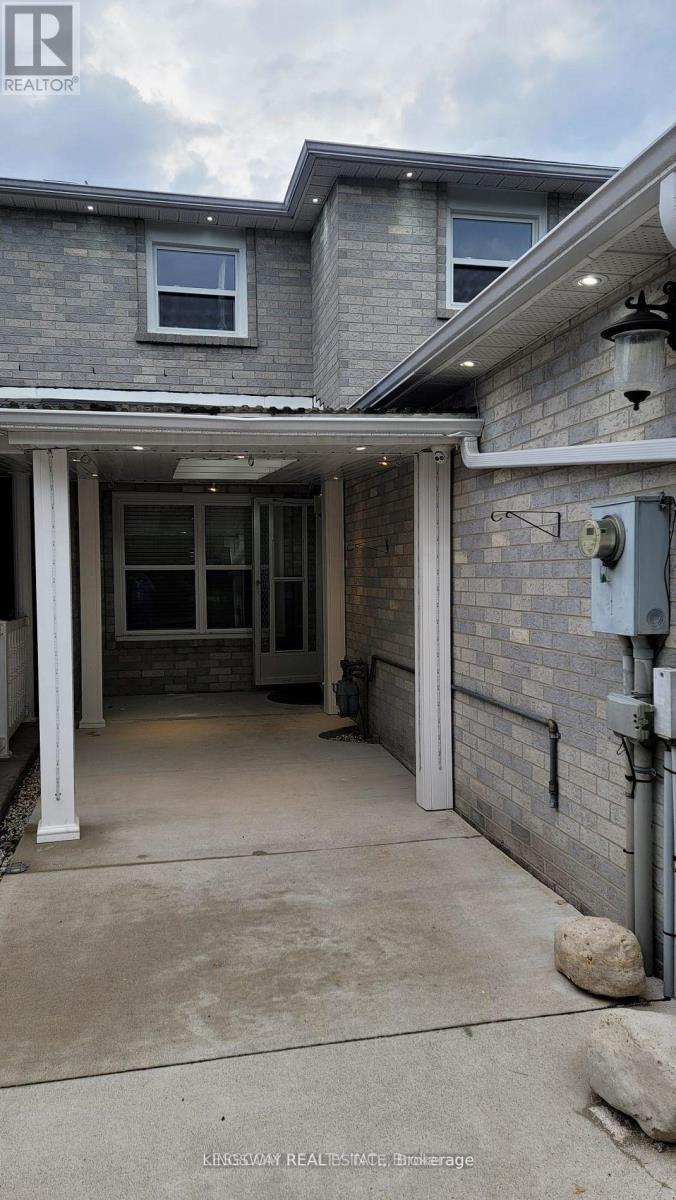 A house with a grey roof and a white door.
