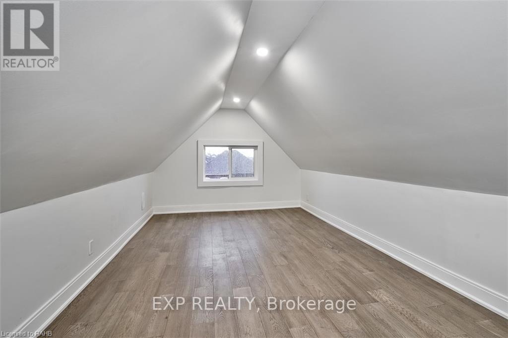 A room with EXP REALTY, Brokerage written on the floor.