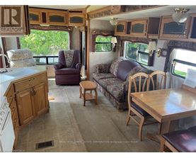 A living room with a couch, chair, and table.