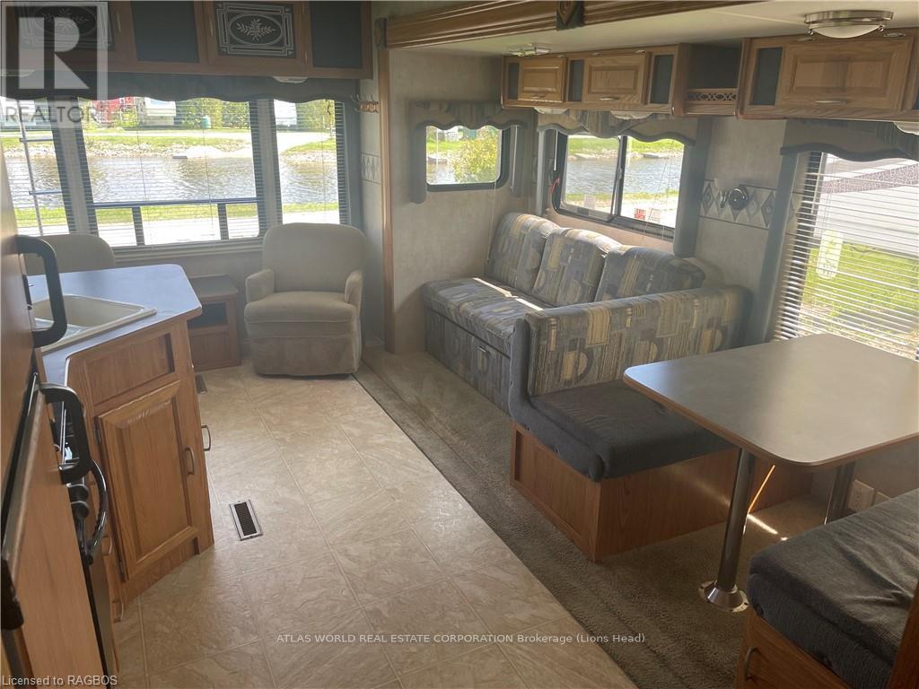 A living room with a couch, chair, and table.