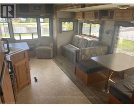 A living room with a couch, chair, and table.