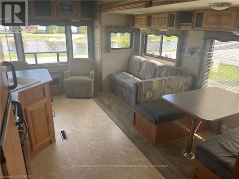 A living room with a couch, chair, and table.