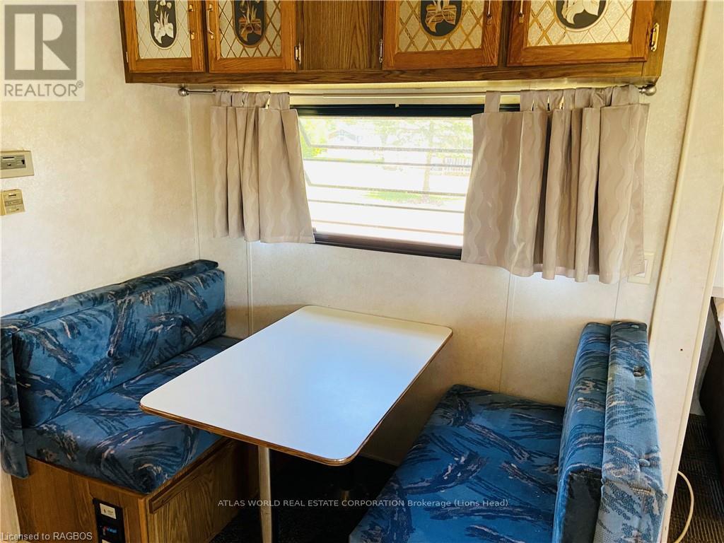 A small table and two couches are in a living room.