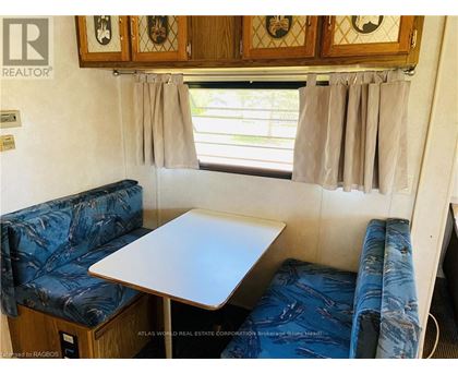 A small table and two couches are in a living room.