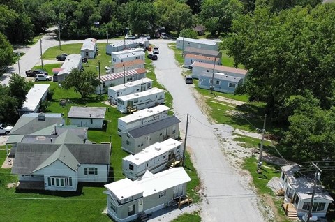 A residential area with houses and a road.