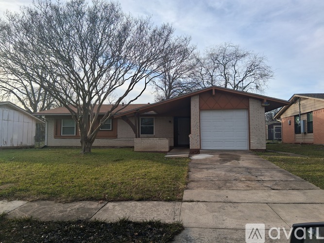 A house with a tree in front of it.