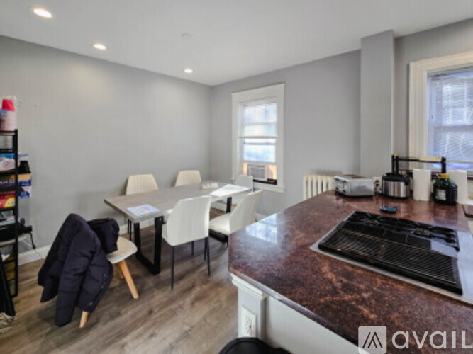 A living room with a couch, chair, and coffee table.