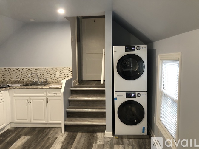 A washer and dryer in a laundry room.