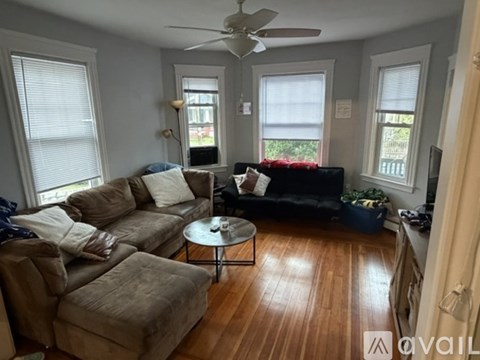 A living room with a sofa, a chair, and a coffee table.