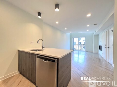 A modern kitchen with a dishwasher and sink.