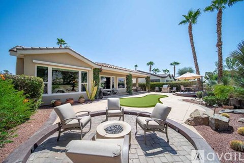 A house with a patio and a pool in the backyard.