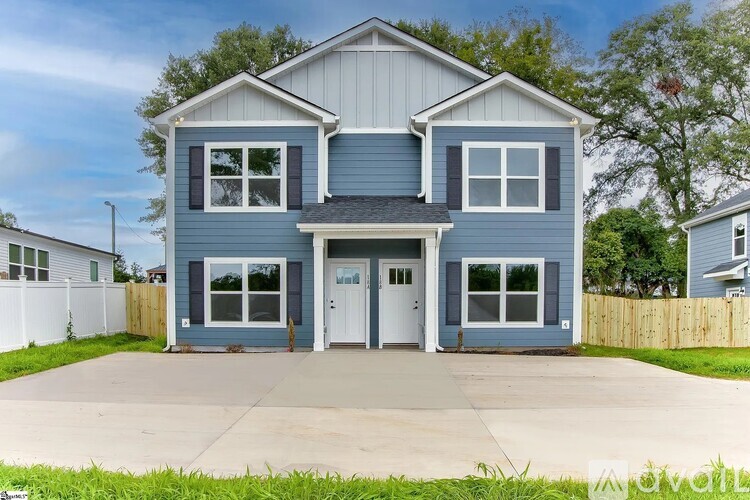 A two-story house with a garage is for sale.