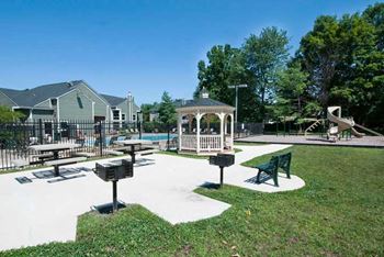 Garden Courtyard with Grills and Fireplace at The Crossings at White Marsh Apartments, White Marsh, Maryland