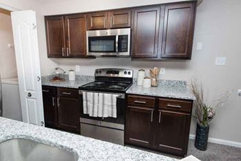 Modern Kitchen With Custom Cabinet at The Crossings at White Marsh Apartments, Maryland, 21128