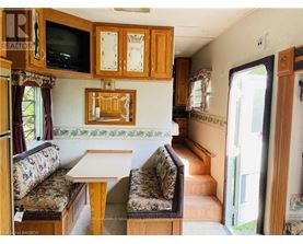 A living room with a couch, a table, and a television.