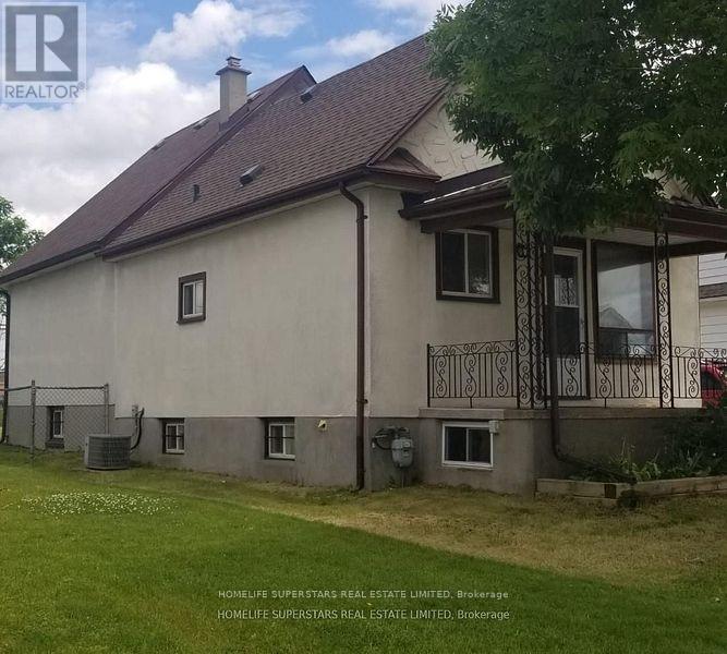 A house with a brown roof and a balcony with a railing.