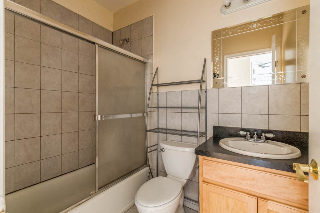 a bathroom with a sink toilet and a shower