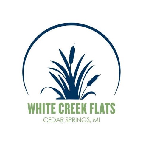 White creek flats logo with a plant in the middle.