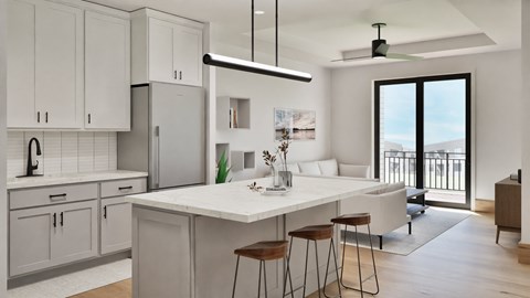 A modern kitchen with white cabinets and a large island.