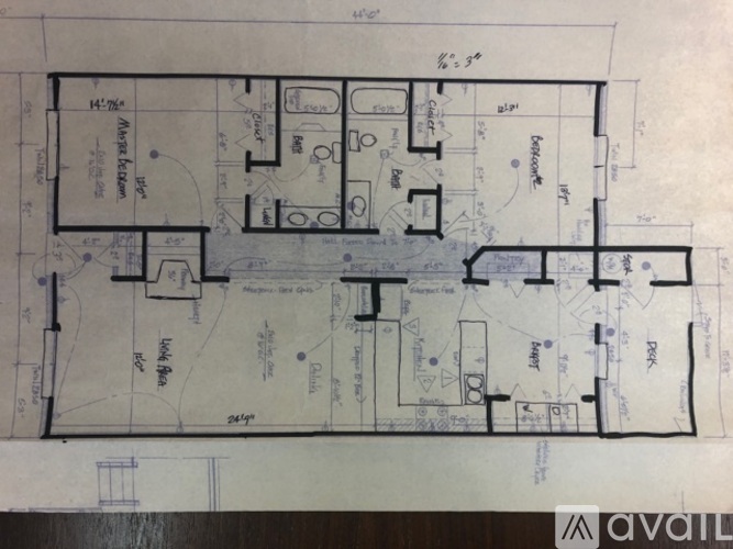 A blueprint shows the layout of a house with various rooms and measurements.