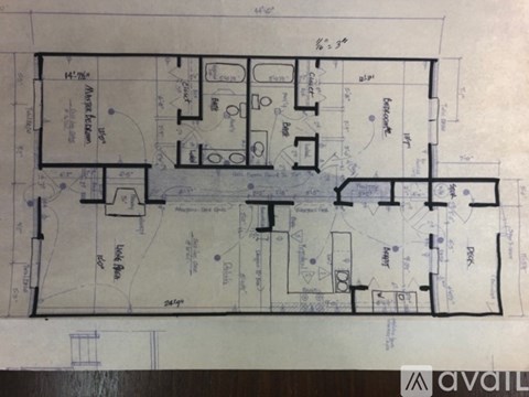 A blueprint shows the layout of a house with various rooms and measurements.