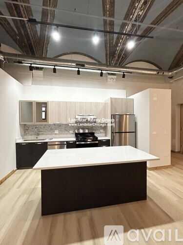 A modern kitchen with a large island in the middle.