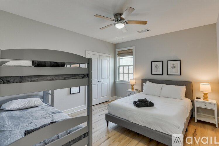 A bedroom with a bunk bed and a single bed.