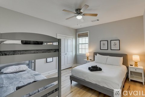 A bedroom with a bunk bed and a single bed.