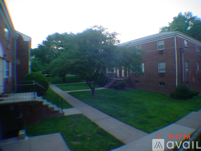 A grassy area in front of a brick building.