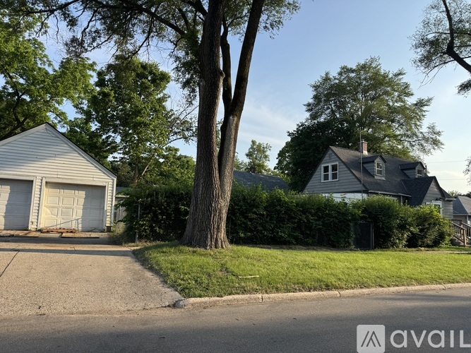 A house with a garage is available for sale.