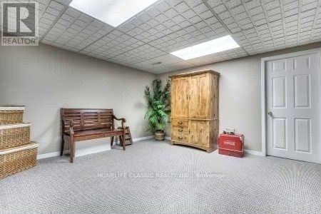 A room with a window and wooden flooring.