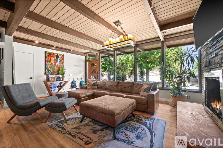 A living room with a fireplace and a couch.