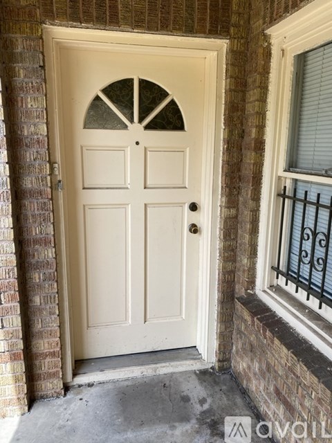A white door with a glass window above it.