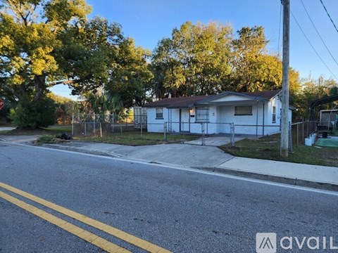 A house is for sale in a residential area.