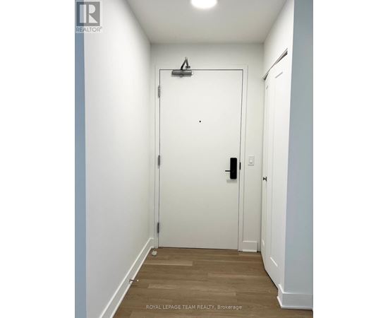 A white door with a black handle and a black lock.