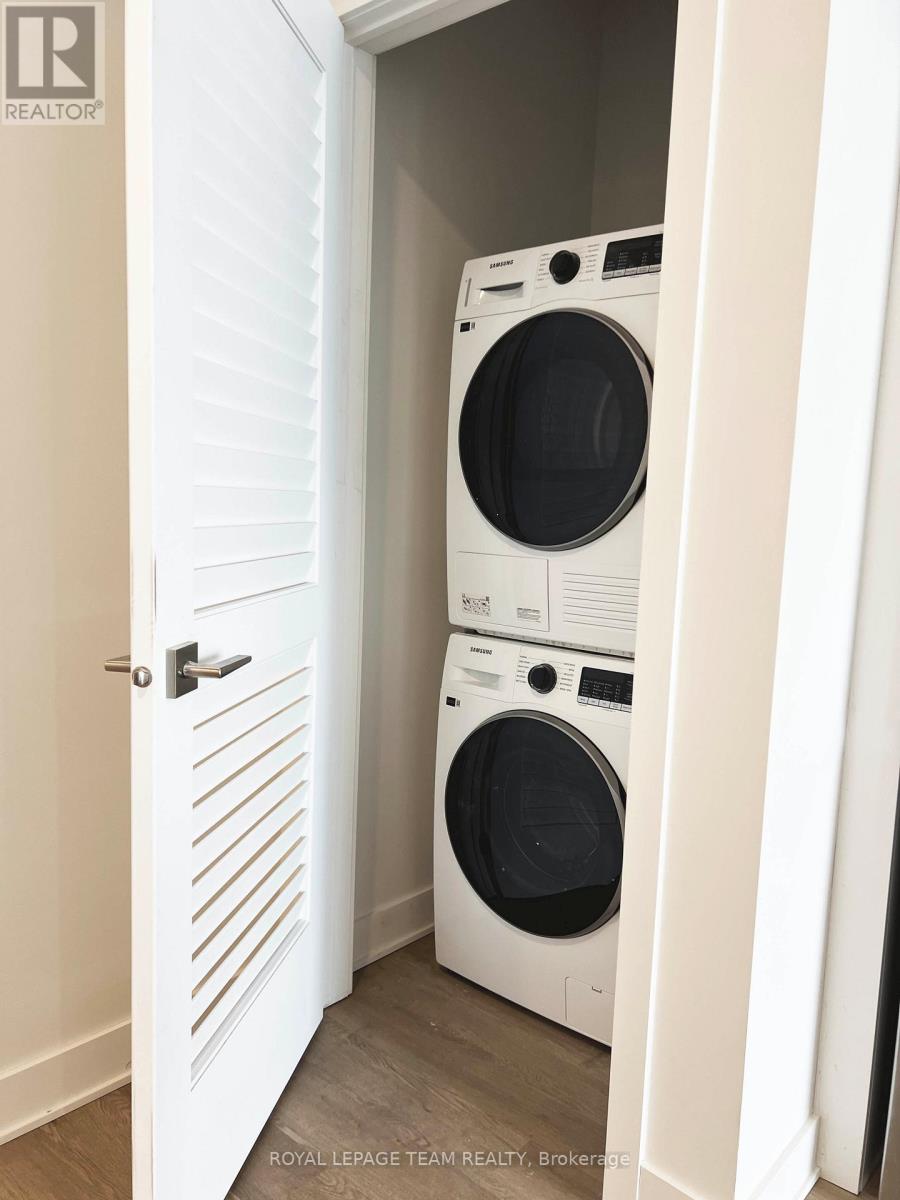 A white door with a washing machine behind it.