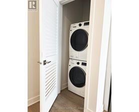 A white door with a washing machine behind it.