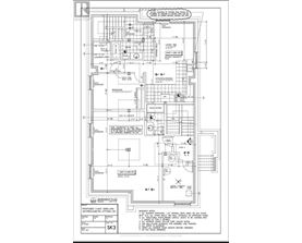 A detailed floor plan for a building, including a basement, first, and second floor with various rooms and measurements.