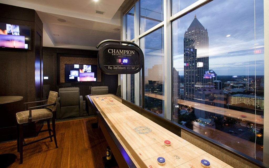 a poker table in a room with a view of the city