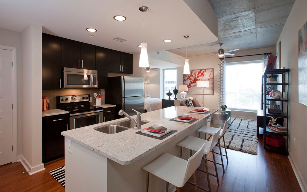 a kitchen with a large island and a counter top