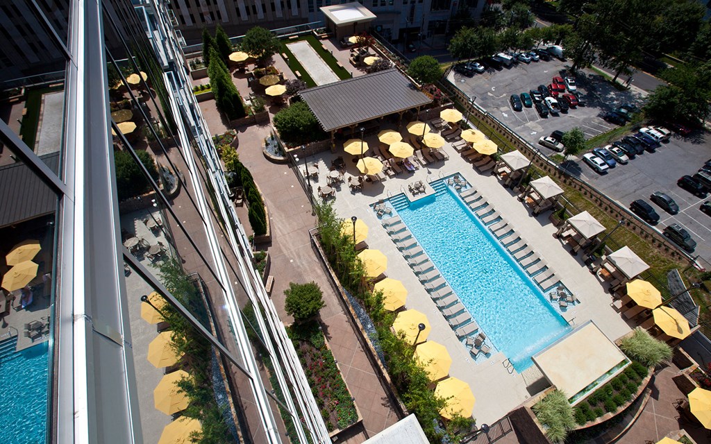a view of a swimming pool from a hotel window