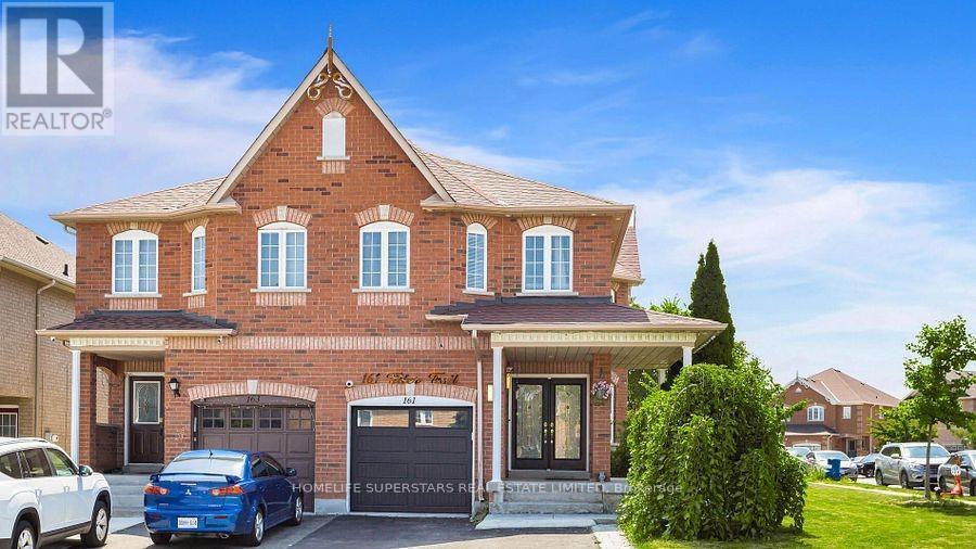 A large brick house with a car parked in front.