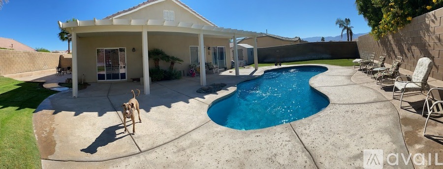 A house with a pool in the backyard.