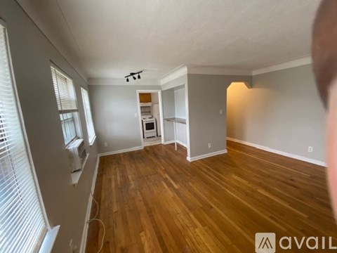 A room with wooden floors and a white ceiling.