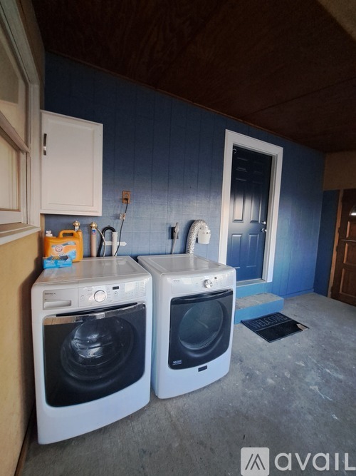 A laundry room with a washer and dryer.