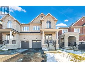 A large, two-story house with a garage is situated in a residential area.